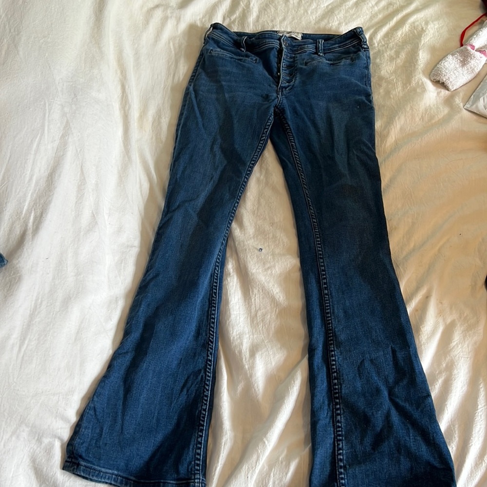 Free people flare jeans with buttons up the front